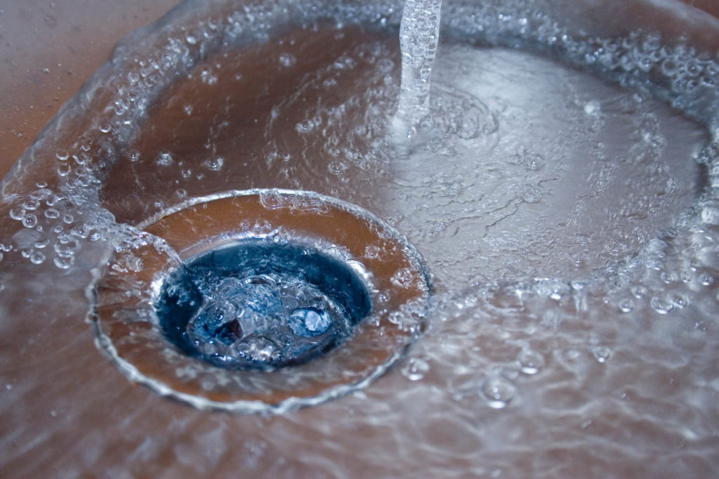 Water pooling around a blocked drain